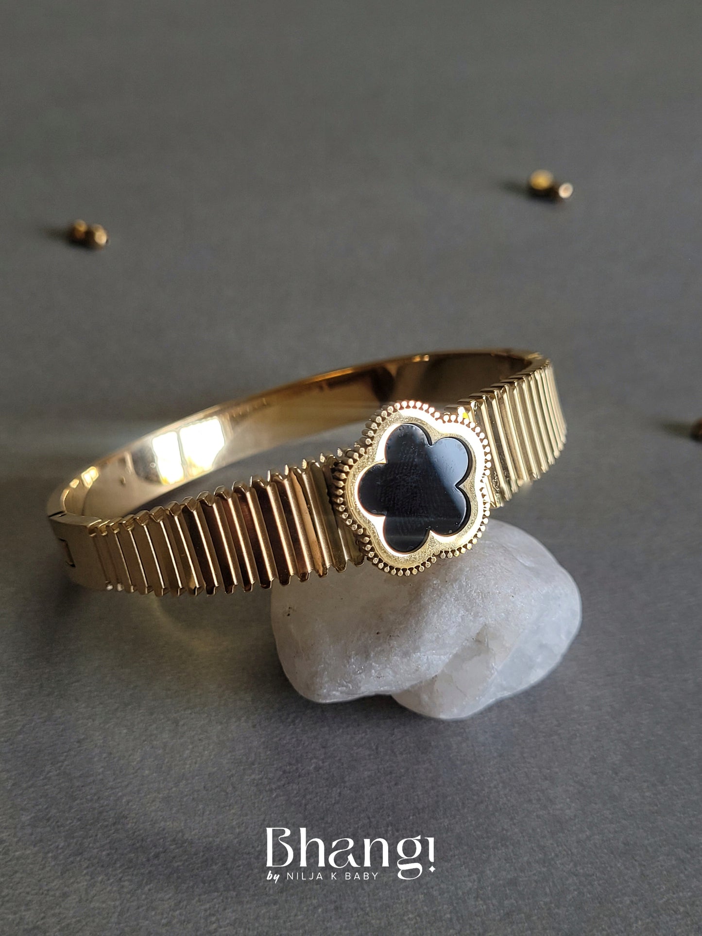 Gold-Tone Bangle with Black Flower